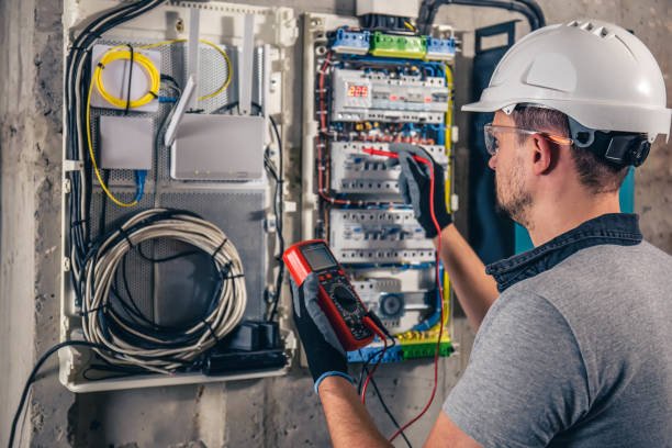 Electrician working on installation